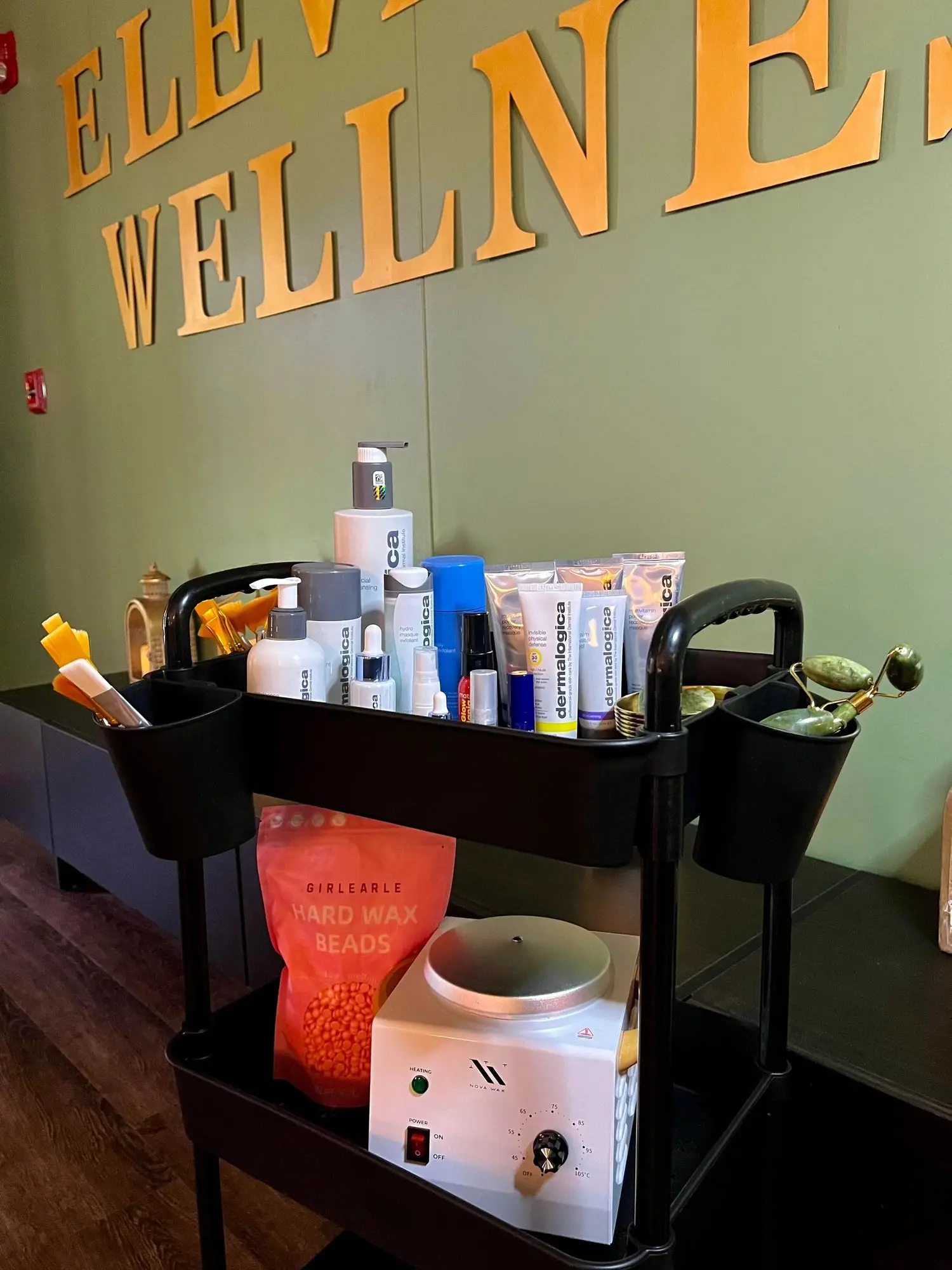 A facial and waxing cart stocked with skin care products